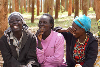 African women laughing outdoors.
