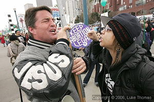 Roe v. Wade supporters and foes arguing in the street.